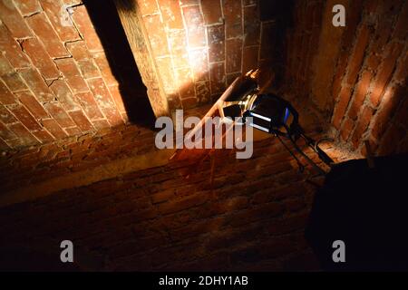 Light illuminating roof of old house with cinema light Stock Photo