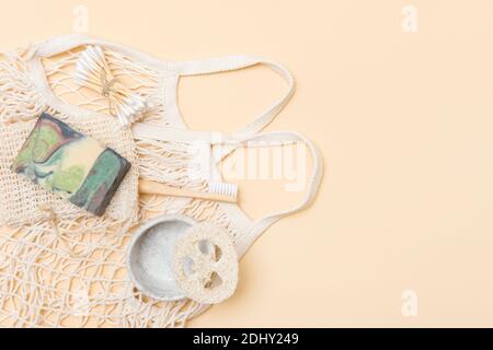 Zero waste bathroom accessories on camel color background. Natural eco bamboo product. Plastic free beauty essentials. Stock Photo