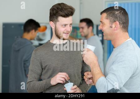 enjoying spending leisure time on work break with colleagues Stock Photo