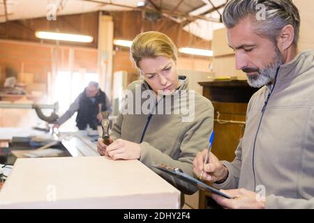 woman and man working in warehouse doing an invertory Stock Photo