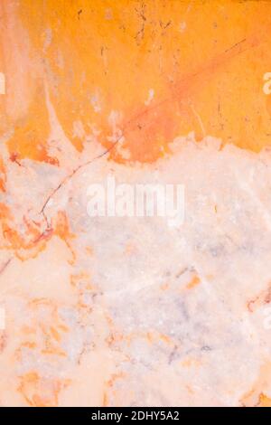 Background of pink and orange yatlian marble with beautiful stains. The natural structure of natural stone in the interior, building and architecture. Stock Photo