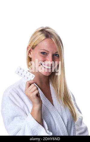 Frau mit Pillenpackung im Mund, Antibaby-Pille, Antibabypille, Model Release, Stock Photo