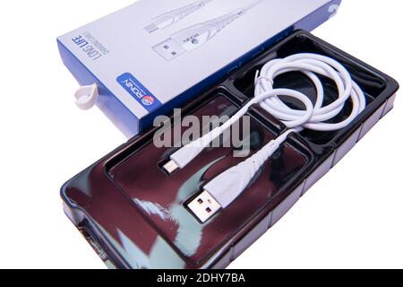 white Android and iPhone Charger Cable Stock Photo