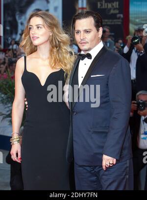 File photo : US actor Johnny Depp and his girlfriend Amber Heard walking the red carpet for the movie Black Mass as part of the 72nd Venice Film Festival (Mostra) in Venice, Italy, on September 4, 2015. Actor Johnny Depp and his wife Amber Heard are divorcing after 15 months of marriage. Amber, 30, cited irreconcilable differences and is seeking spousal support from the Pirates Of The Caribbean star, according to court records. The pair, who do not have children together, married in February last year after co-starring in the 2011 film The Rum Diary. Photo by Marco Piovanotto /ABACAPRESS.COM Stock Photo