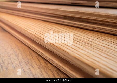 Side view, selective focus of light Engineered hardwood or laminate flooring samples. Stock Photo