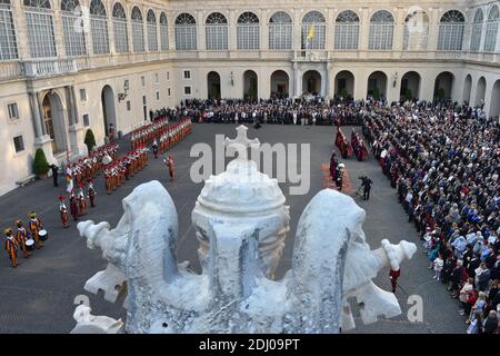 The Vatican's Swiss Guards swore in 23 new recruits on May 6, 2016 at the Vatican. The new recruits joined their ranks in an elaborate swearing-in ceremony . The ceremony is held each May 6 to commemorate the 147 Swiss Guards who died protecting Pope Clement VII during the 1527 Sack of Rome. Then each new recruit grasped the corps' flag and, raising three fingers in a symbol of the Holy Trinity, swore to uphold the Swiss Guard oath to protect pope Francis and his successors. The Swiss Guard, founded in 1506, consists of 100 volunteers who must be Swiss nationals, Catholic, single, at least 174 Stock Photo