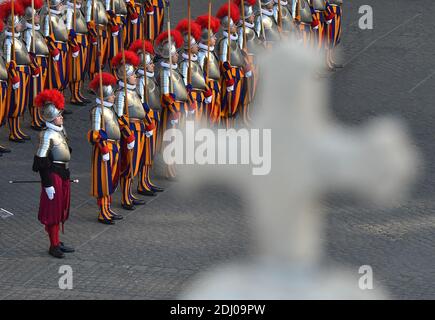 The Vatican's Swiss Guards swore in 23 new recruits on May 6, 2016 at the Vatican. The new recruits joined their ranks in an elaborate swearing-in ceremony . The ceremony is held each May 6 to commemorate the 147 Swiss Guards who died protecting Pope Clement VII during the 1527 Sack of Rome. Then each new recruit grasped the corps' flag and, raising three fingers in a symbol of the Holy Trinity, swore to uphold the Swiss Guard oath to protect pope Francis and his successors. The Swiss Guard, founded in 1506, consists of 100 volunteers who must be Swiss nationals, Catholic, single, at least 174 Stock Photo