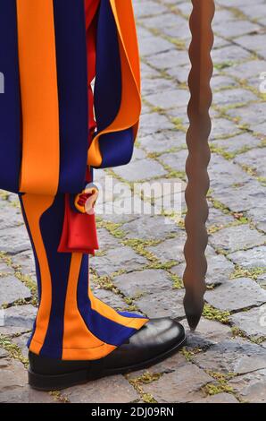 The Vatican's Swiss Guards swore in 23 new recruits on May 6, 2016 at the Vatican. The new recruits joined their ranks in an elaborate swearing-in ceremony . The ceremony is held each May 6 to commemorate the 147 Swiss Guards who died protecting Pope Clement VII during the 1527 Sack of Rome. Then each new recruit grasped the corps' flag and, raising three fingers in a symbol of the Holy Trinity, swore to uphold the Swiss Guard oath to protect pope Francis and his successors. The Swiss Guard, founded in 1506, consists of 100 volunteers who must be Swiss nationals, Catholic, single, at least 174 Stock Photo