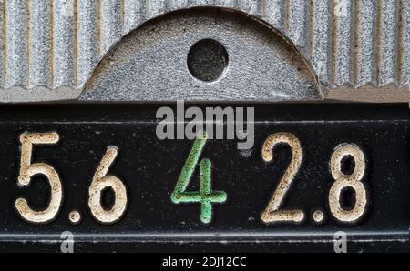Close up high resolution macro photograph of a vintage lens apeture focus gauge Stock Photo