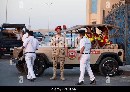 Members of the Egyptian police force stand guard outside the El-Mosheer Tantawy Mosque ahead of the memorial ceremony held by EgyptAir for realtives and family members of EgyptAir staff on flight MS804 on May 23, 2016 in Cairo, Egypt. Egyptian President Abdel Fattah el-Sisi announced Sunday that a submarine will be deployed to search for the flights black box. Photo by Etienne Bouy/ABACAPRESS.COM Stock Photo