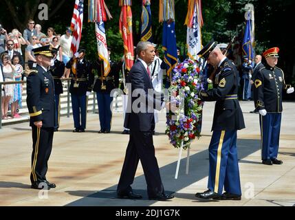 U.S.President Barack Obama (C) is assisted as he lays a wteath at the Tomb of the Unknown Soldier at Arlington National Cemetery, Arlington, Virginia, on Memorial Day, May 30, 2016, near Washington, DC. Obama paid tribute to the nation's military service members who have fallen. Photo by Mike Theiler/Pool/ABACAPRESS.COM Stock Photo
