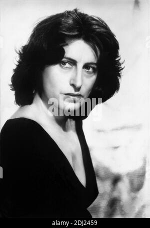 1955 , USA : The celebrated italian movie actress  ANNA  MAGNANI  in Hollywood Paramount Pictures Studio for the movie THE  ROSE TATTOO ( 1955 - La rosa tatuata ) by  Daniel Mann , from a play by Tennessee Williams  - MOVIE - FILM - CINEMA - attrice - portrait - ritratto  - capelli lunghi - long hair - spalla - shoulder - spalle - shoulders -  black dress - abito nero vestito - decolleté - scollatura - neckopening - neckline  ----  Archivio GBB Stock Photo