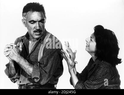 1958 , USA : The italian movie actress ANNA  MAGNANI with  Anthony Queen  in  WILD IS THE WIND  ( Selvaggio è il vento )  by George Cukor , from the novel  ' Furia ' by Vittorio Nino Novarese  - CINEMA - FILM - attrice - dramma - drama ----  --- Archivio GBB Stock Photo