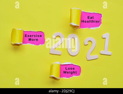 Text on colorful torn paper with Year 2021 background. Happy New Year 2021 Concept Stock Photo