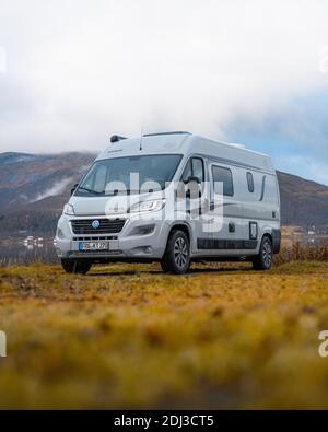 Campervan parked in the parking lot at Fjordbotn Camping, Senja, Norway Stock Photo