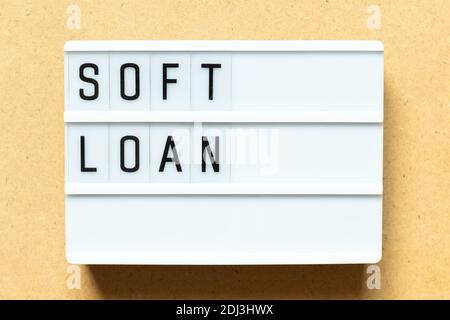 Lightbox with word soft loan on wood background Stock Photo