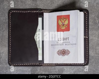 handmade leather cover for documents with two cards and a passport Stock Photo