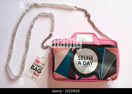 Selfie a day face first cosmetic bag let's make up kiss x isolated on white background Stock Photo