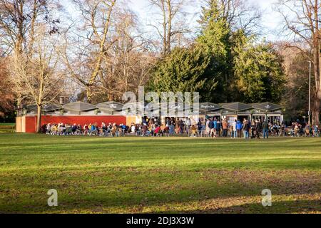 Northampton, UK 12th December 2020. The Park Cafe in Abington Park queues waiting to be served with vey little social distancing on a sunny afternoon, the cafe is owned by the ex Mayor of Northampton.   Credit: K J Smith./Ģ����ý Live News Stock Photo