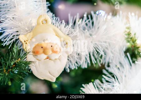 Santa Clause Ornament on Christmas Tree with copy space. Stock Photo