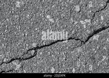 Asphalt with crack background. Old gray road for background or texture. Asphalt as abstract background or backdrop. Banner toned in trendy color of 20 Stock Photo