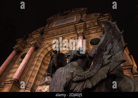Statue of Archangel Michael slaying a dragon at the Mont Saint-Michel ...