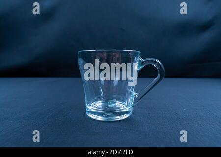 Empty glass on black background with mirroring Stock Photo