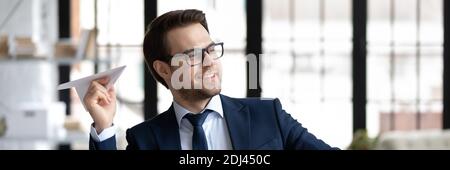 Horizontal banner happy businessman having fun with paper plane Stock Photo