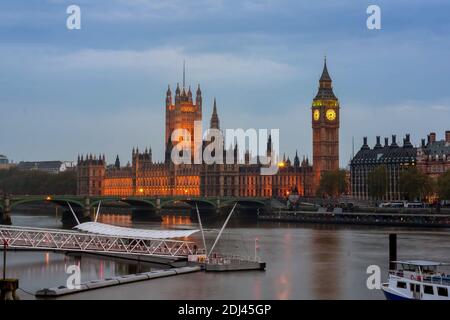 LONDON, UK - MAY 03, 2008:  View across the River Thames of the Houses of Parliament and Big Ben at dusk with Waterloo Pier in the foreground Stock Photo