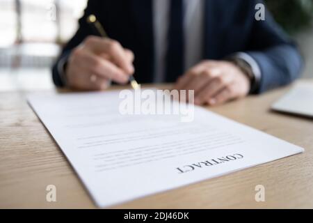 Close up businessman signing contract, putting signature on legal document Stock Photo
