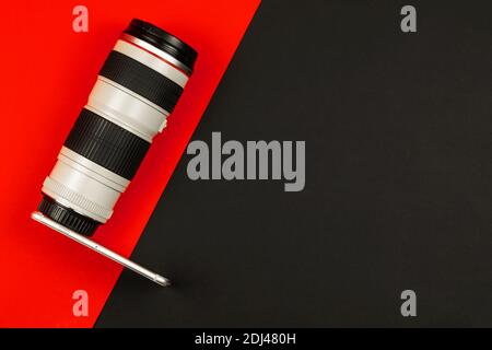 Cool camera concept, smartphone with DSLR lens, composition and comparison, simple background, copy space, top view Stock Photo