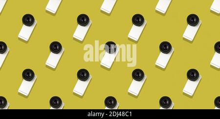 Seamless flat pattern, smartphone with a big camera from a DSLR, minimal concept, banner, gold background photo Stock Photo