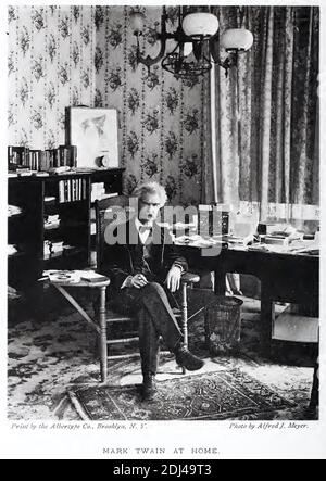 Vintage photograph of Mark Twain sitting at home in New York.