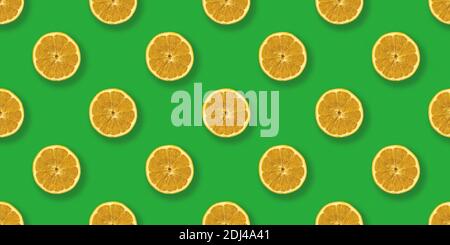 Lemon pattern pop art flat lay design, food on green background Stock Photo