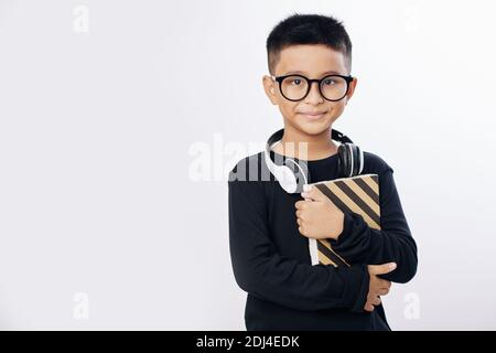 Boy with book and headphones Stock Photo