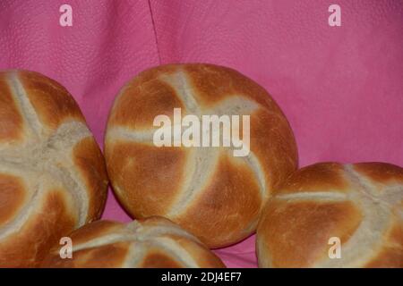 homemade wheat bread rolls on pink napkins close-up Stock Photo