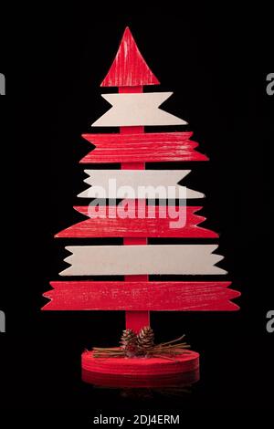 Handmade wooden Christmas tree  on black background Stock Photo