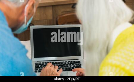 Beautiful senior couple of lovers  - Elderly people portrait while having fun at home - Concepts about relationship, elderly people and lifestyle Stock Photo