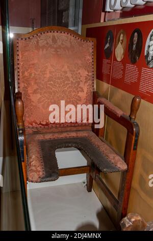 A folding parturition chair, or birthing chair (c. 1601-1700, Germany) in the National Civil War Centre, Newark Museum, Newark-on-Trent, Notts, UK. Stock Photo