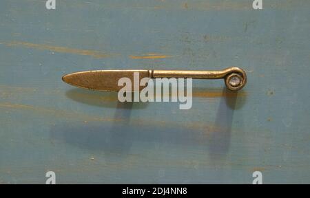 Kitchen decoration. A knife in the form of a cabinet handle. Stock Photo