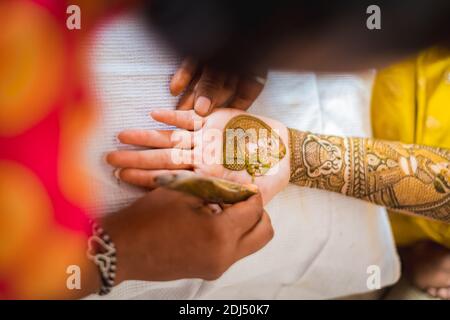 hand of an indian bride decorated with henna or mehndi Stock Photo