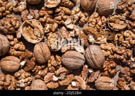 scattered whole walnuts and nuts Stock Photo