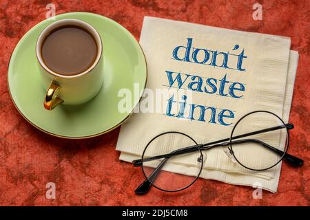 do not waste time - inspirational handwriting on a napkin with a cup of coffee, business, procrastination and productivity concept Stock Photo