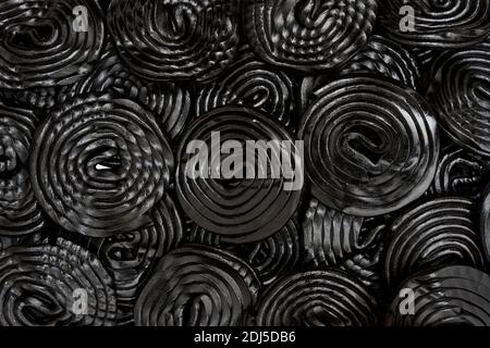 group of spiral wheels of black licorice isolated on white background Stock Photo