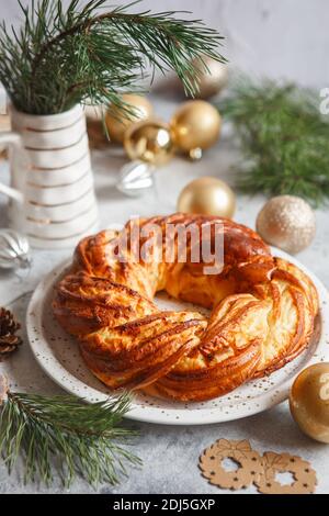 Sweet Bread Wreath decorated with stars cookies. Honey brioche garland with dried berries and nuts. Holiday recipes. Braided Bread. Cinnamon Twist Bre Stock Photo
