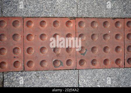 Visually impaired sign located on the ground Stock Photo