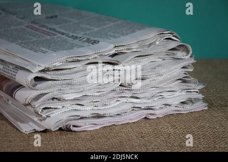 Folded newspapers in a stack Stock Photo