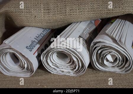 Three rolled newspapers Stock Photo