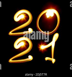2021 year. Nubmer created by light on the black background. Light painting photography, lettering Stock Photo