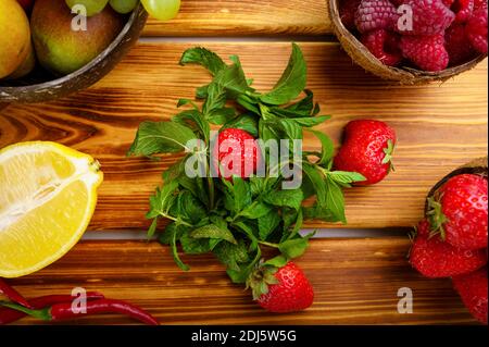 Vegetables, fruits and berries, wooden background Stock Photo